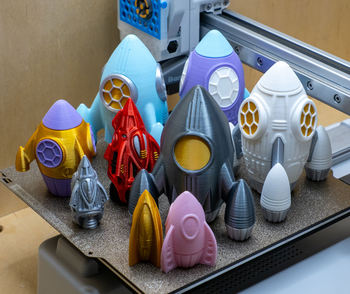 several 3D printed rockets designed by James Fryer